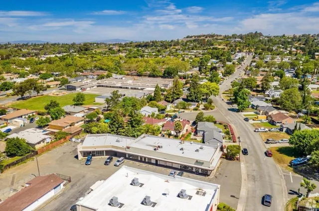 an aerial view of residential houses with outdoor space