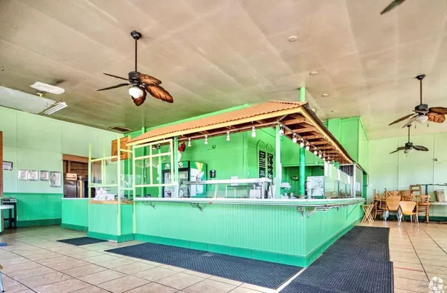 a view of a porch with furniture and garden