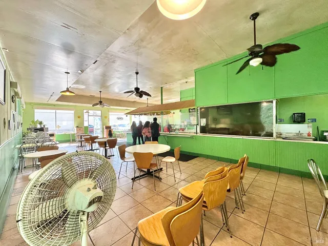 a kitchen with a stove and a white refrigerator