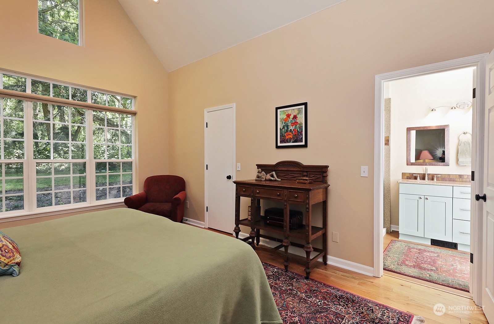 6501 Wahl Road Freeland, WA 98249 - Photo 12 of 40 a bedroom with a bed and a tv on table