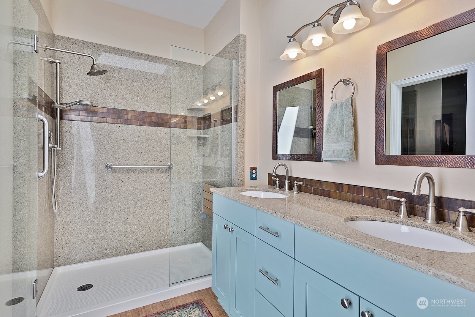 6501 Wahl Road Freeland, WA 98249 - Photo 13 of 40 a bathroom with a double vanity sink mirror double and shower