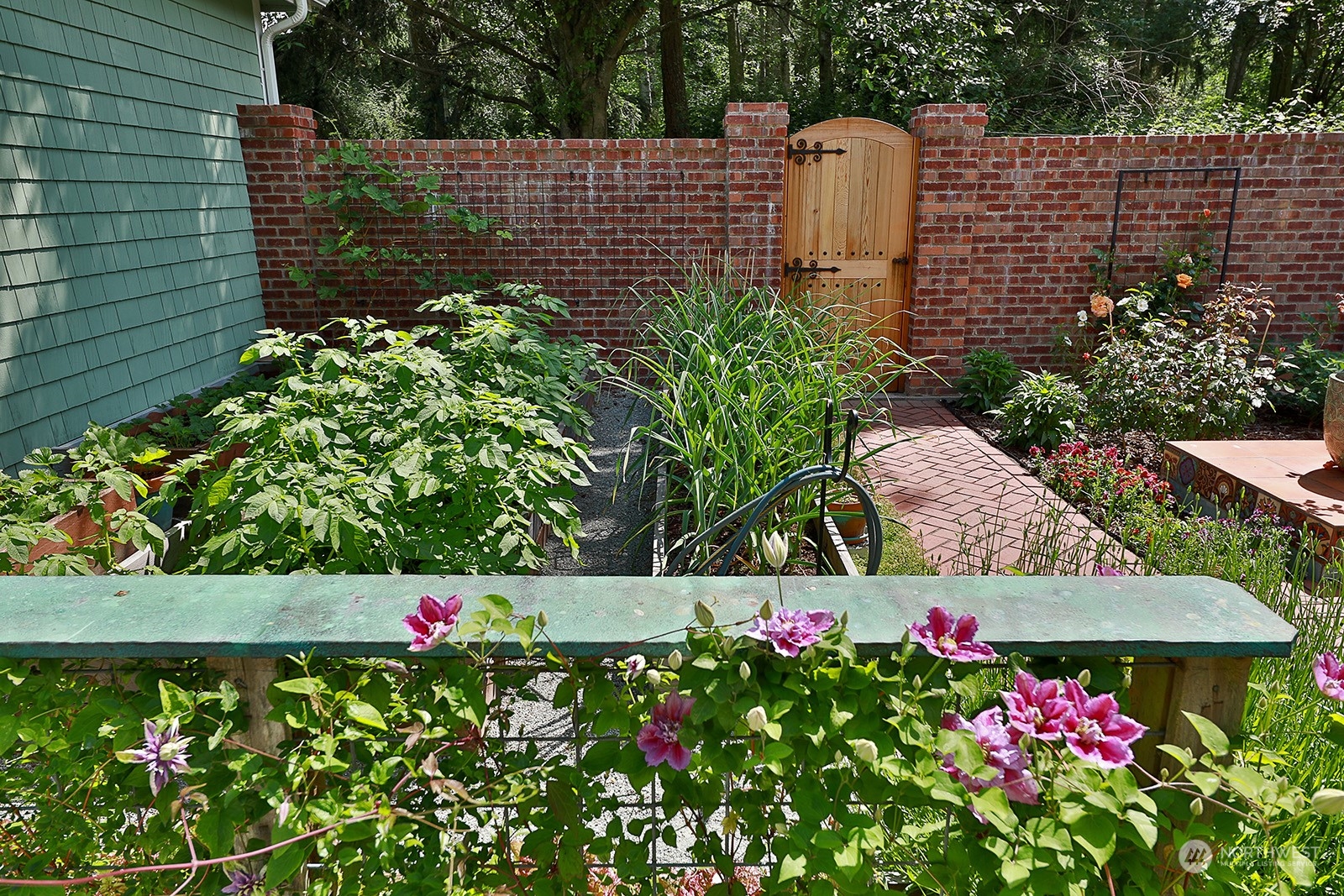 6501 Wahl Road Freeland, WA 98249 - Photo 31 of 40 a view of flowers in back yard of a house