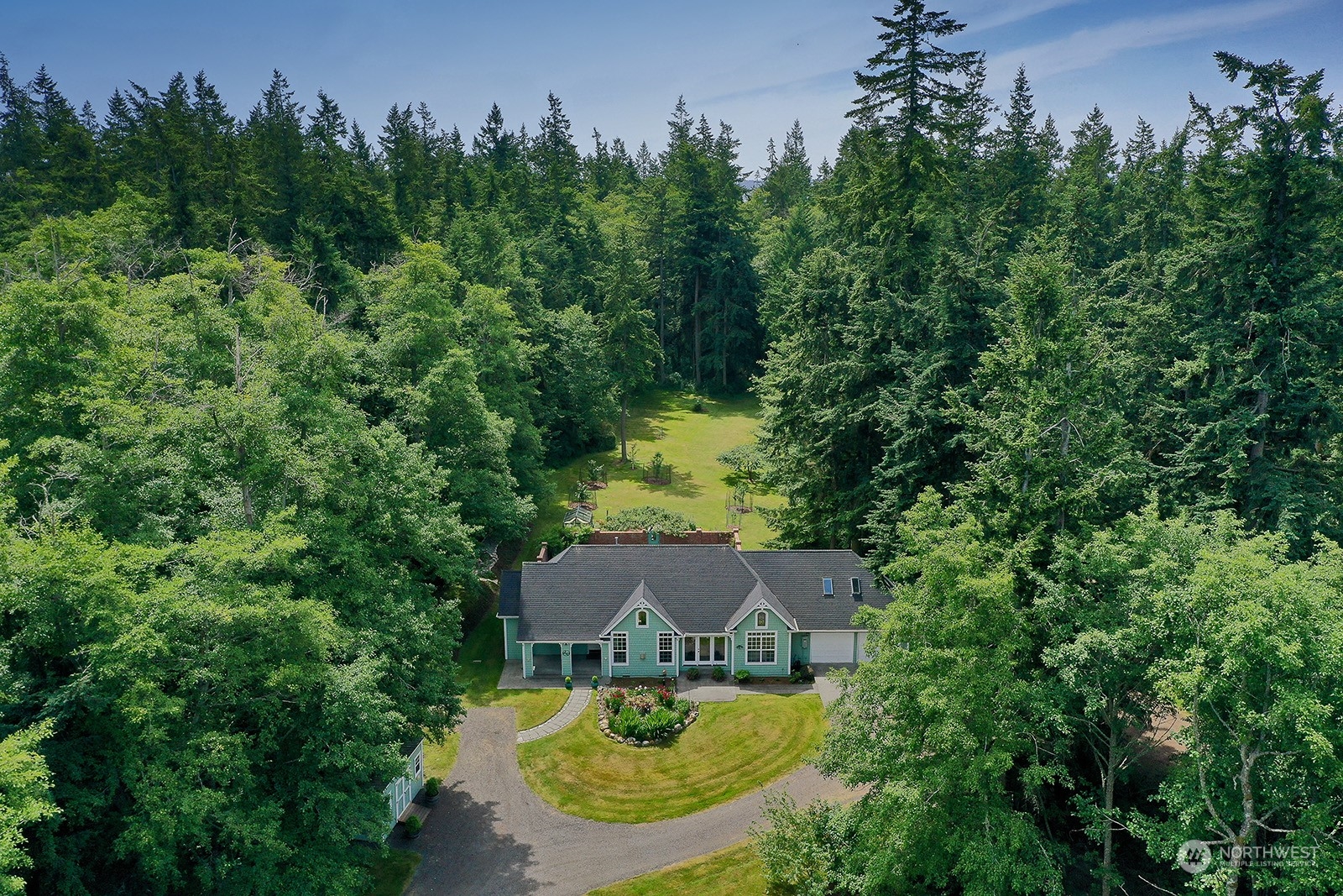 6501 Wahl Road Freeland, WA 98249 - Photo 36 of 40 an aerial view of a house with swimming pool and garden
