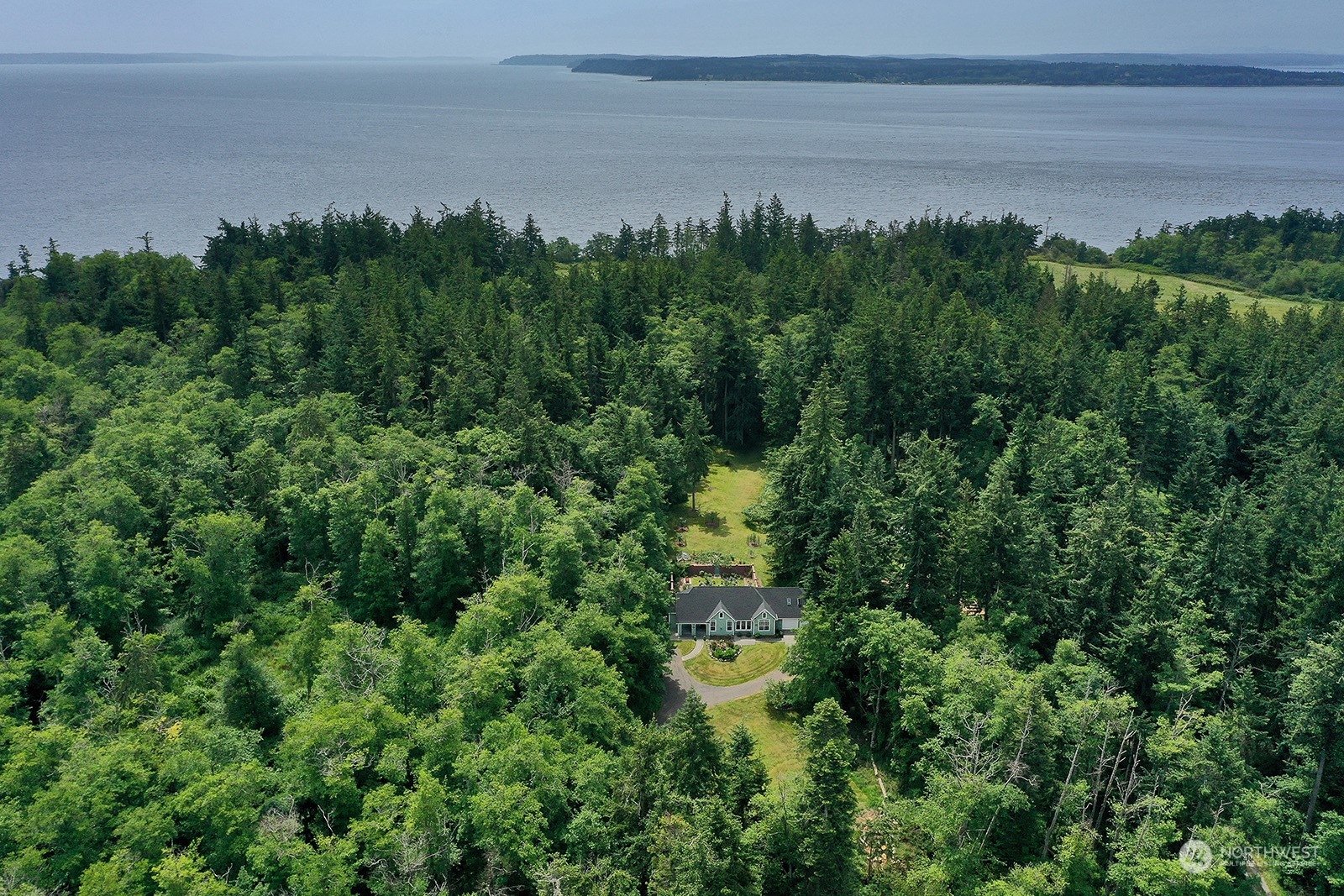 6501 Wahl Road Freeland, WA 98249 - Photo 40 of 40 a view of a yard with a lake view