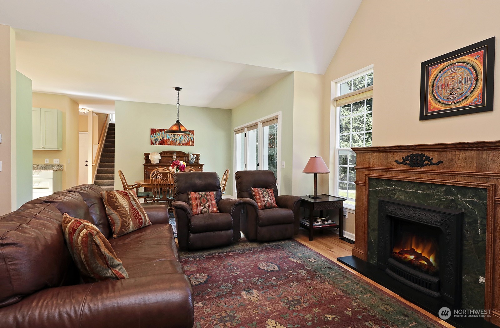 6501 Wahl Road Freeland, WA 98249 - Photo 6 of 40 a living room with furniture and a fireplace