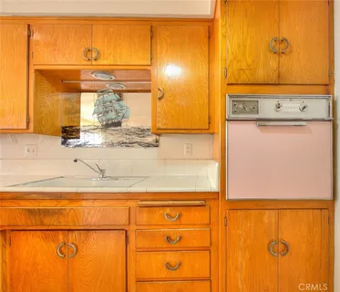 a bathroom with a sink and a granite countertop