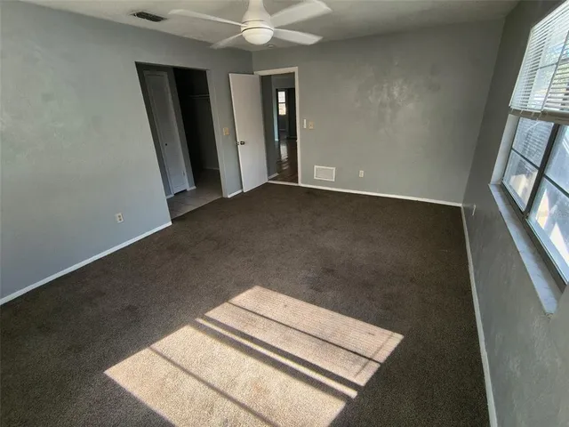 an empty room with windows