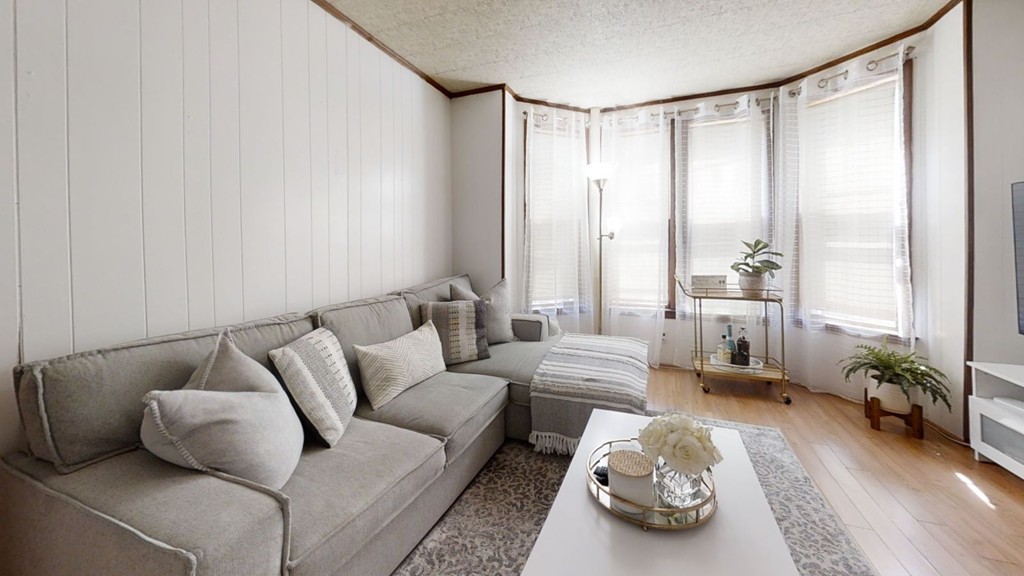 49 Braeburn Road Boston, MA 02136 - Photo 1 of 18 a living room with furniture and a large window
