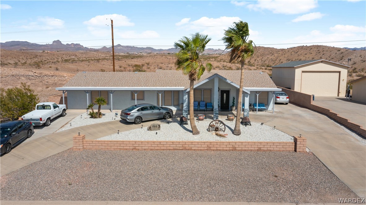 784 Pegasus Ranch Road Bullhead City, AZ 86429 - Photo 87 of 100 Single-story residence featuring a light-colored exterior and a covered front entry