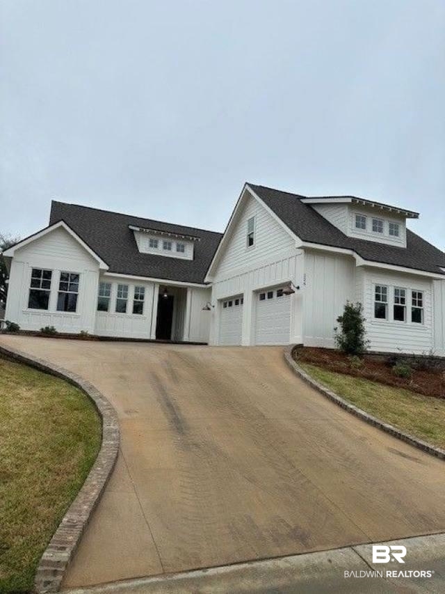 226 Aster Circle Fairhope, AL 36532 - Photo 1 of 1 Modern farmhouse featuring a shingled roof, board and batten siding, and driveway