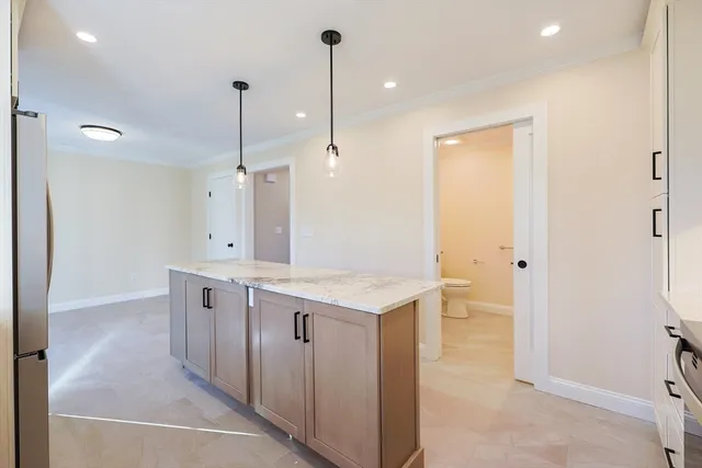 a kitchen with a sink and refrigerator