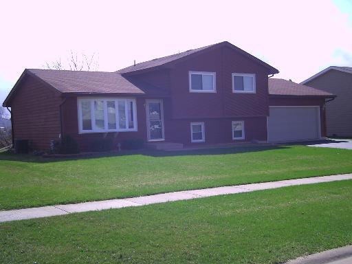 936 Lake Road New Lenox, IL 60451 - Photo 1 of 1 a brick house with a yard
