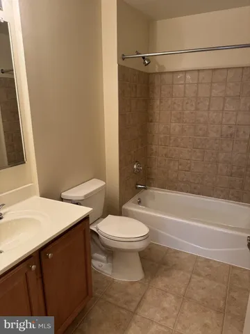 a bathroom with a sink a toilet and a bathtub