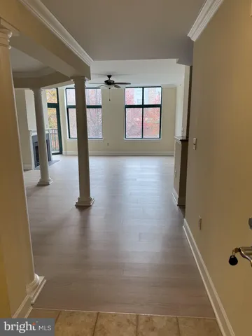 a view of an entryway with wooden floor