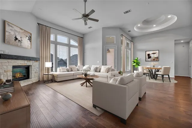 a living room with furniture and a fireplace