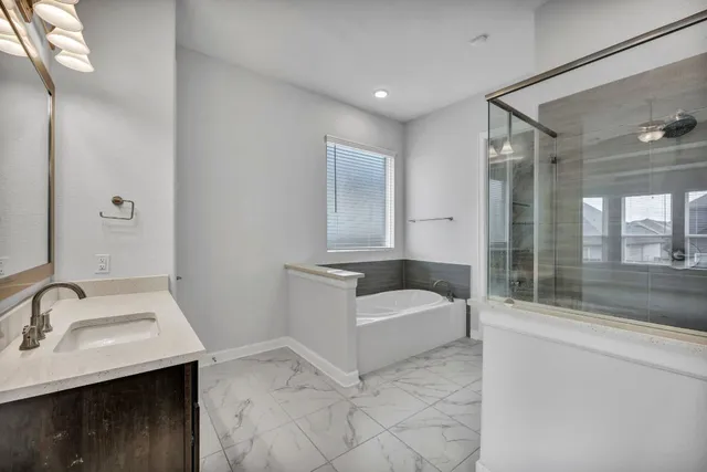 a bathroom with a sink and mirror