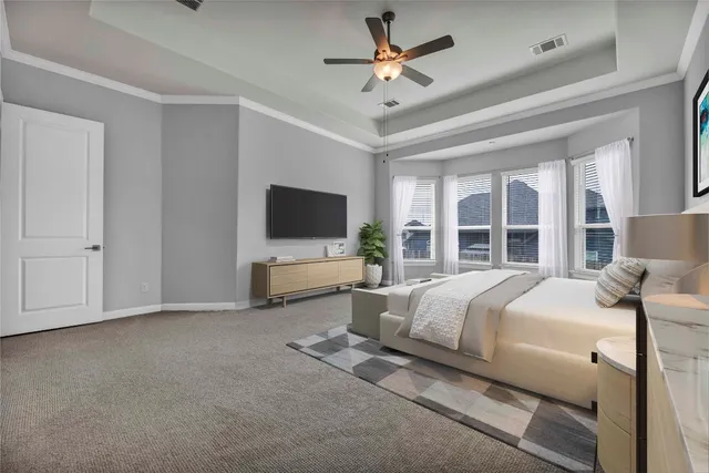 a bed room with a bed and a flat tv screen