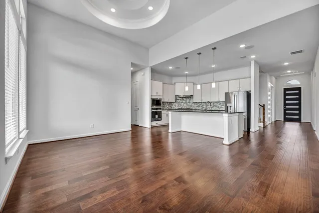 a view of kitchen with wooden floor and center island