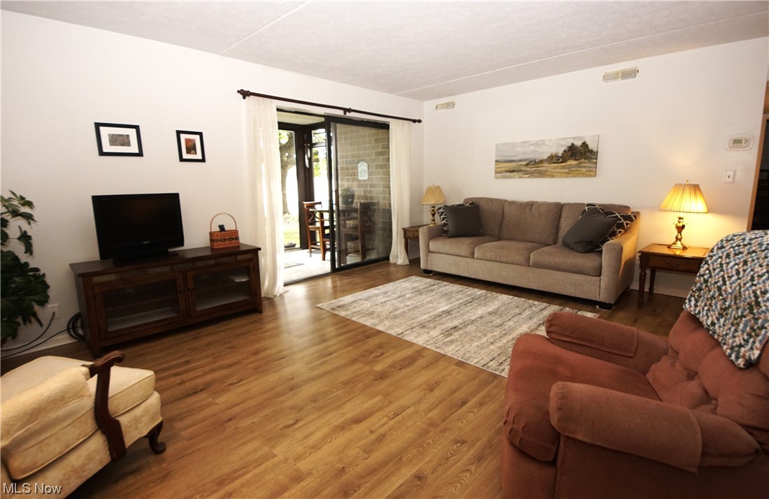 22946 Mastick Road, Unit 102 Cleveland, OH 44126 - Photo 4 of 25 Living room featuring light hardwood floors