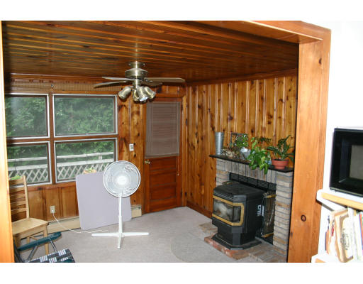 25 Sherwood Road Springfield, MA 01119 - Photo 3 of 5 a living room with furniture a flat screen tv and a fireplace