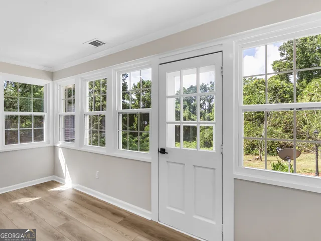 a view of a kitchen cabinets and wooden floor