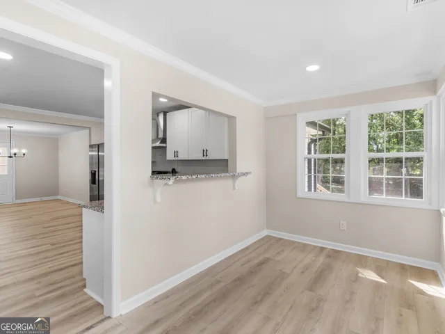 a view of a kitchen with a sink and a window