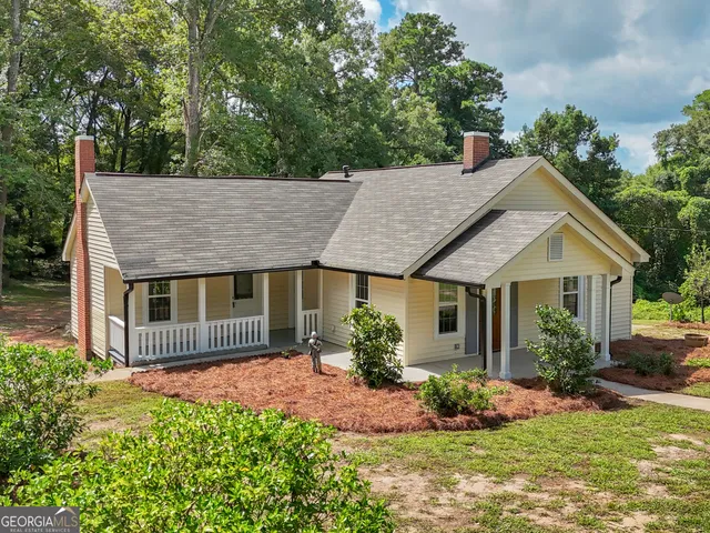 front view of a house with a yard