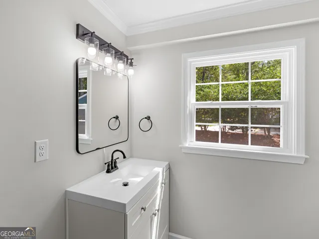 a bathroom with a toilet and a sink