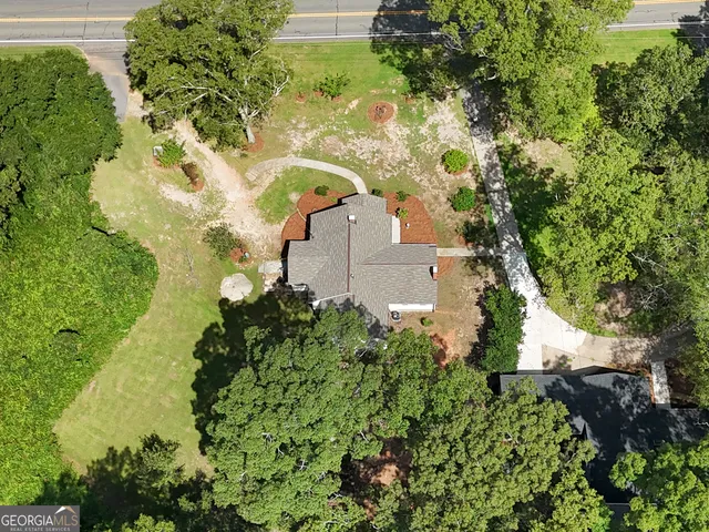 an aerial view of houses with yard