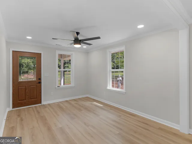 a view of an empty room with a window