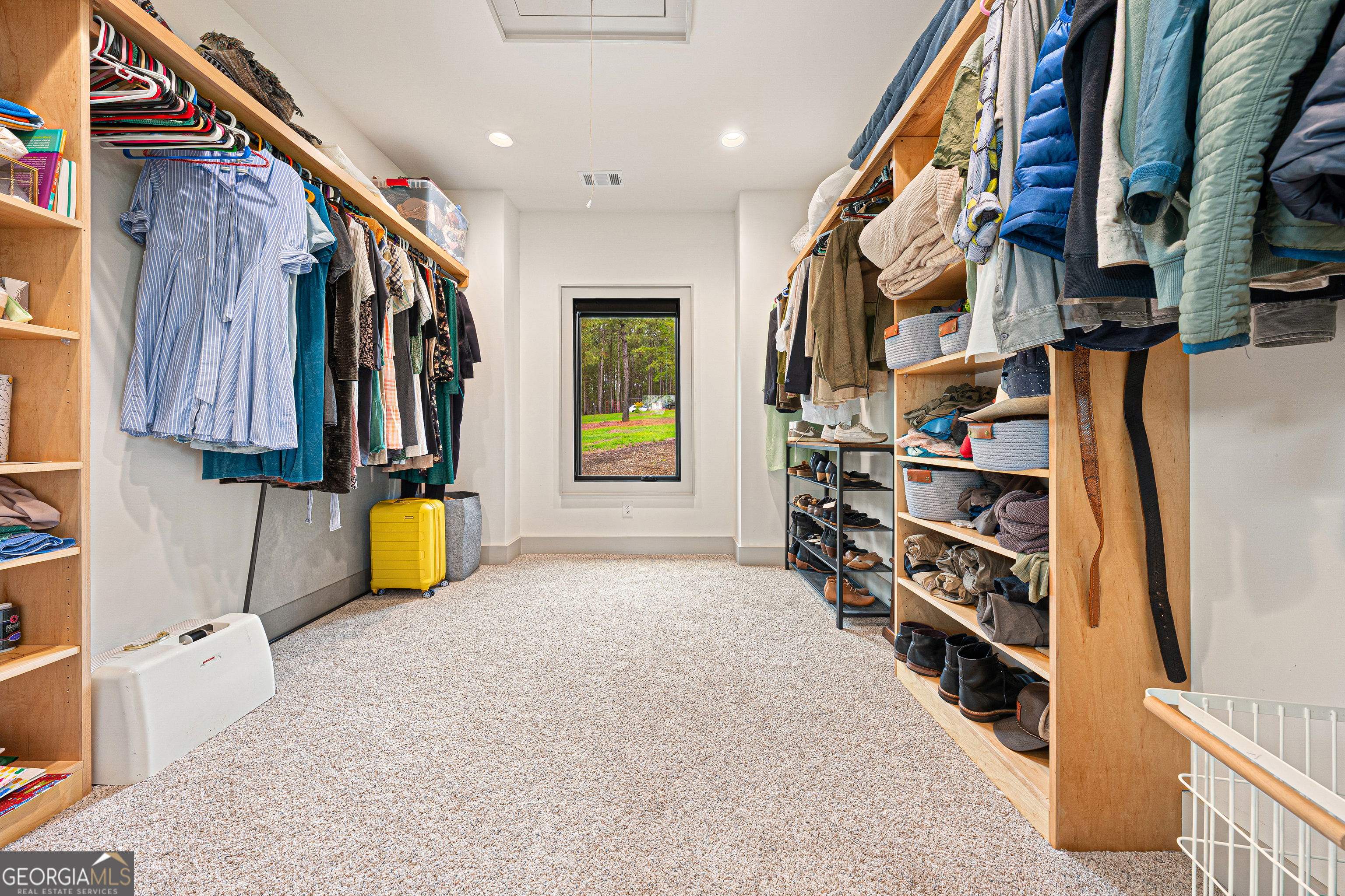 630 Human Road Bowman, GA 30624 - Photo 13 of 36 a view of walk in closet with clothes and shoes