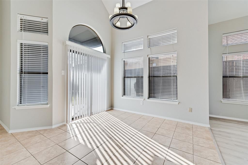 903 Ragland Drive Cedar Hill, TX 75104 - Photo 11 of 33 a view of a room with wooden floor and windows
