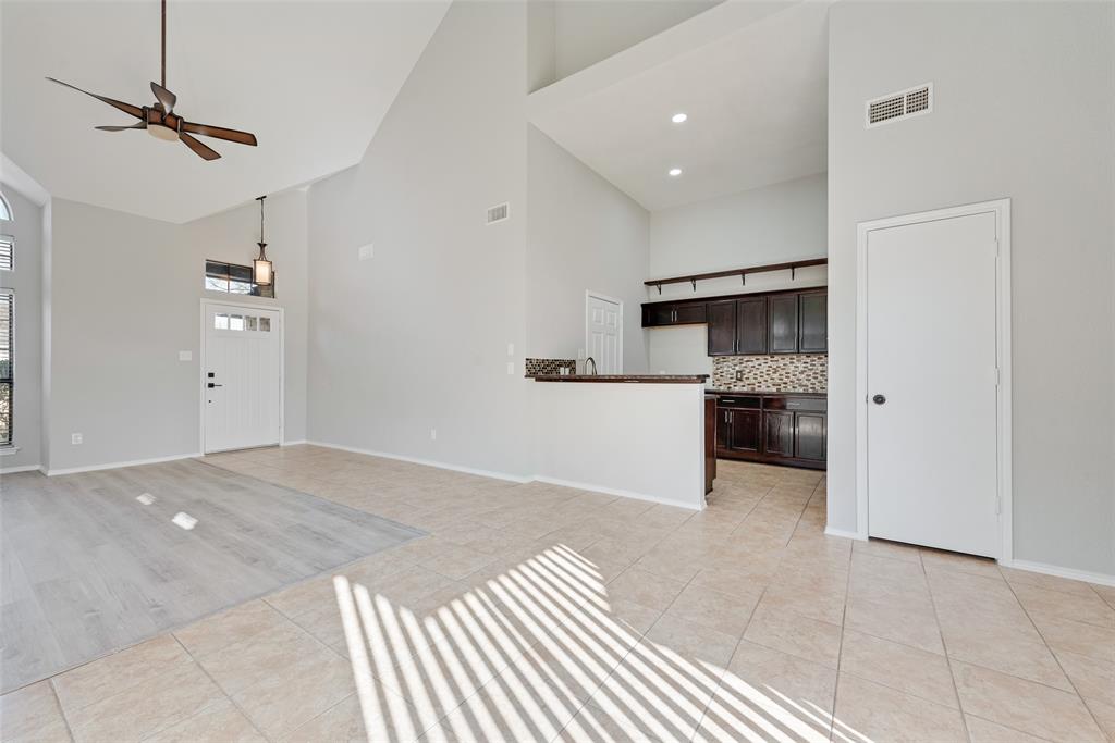 903 Ragland Drive Cedar Hill, TX 75104 - Photo 13 of 33 a view of a kitchen with a sink and a refrigerator
