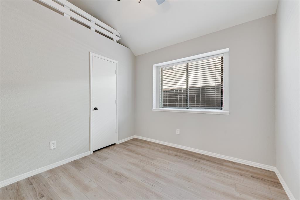 903 Ragland Drive Cedar Hill, TX 75104 - Photo 21 of 33 a view of an empty room with wooden floor and a window