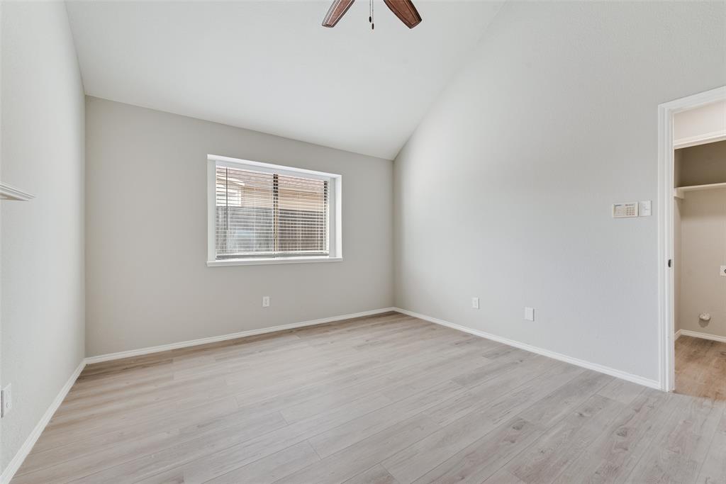 903 Ragland Drive Cedar Hill, TX 75104 - Photo 25 of 33 an empty room with a window and a ceiling fan