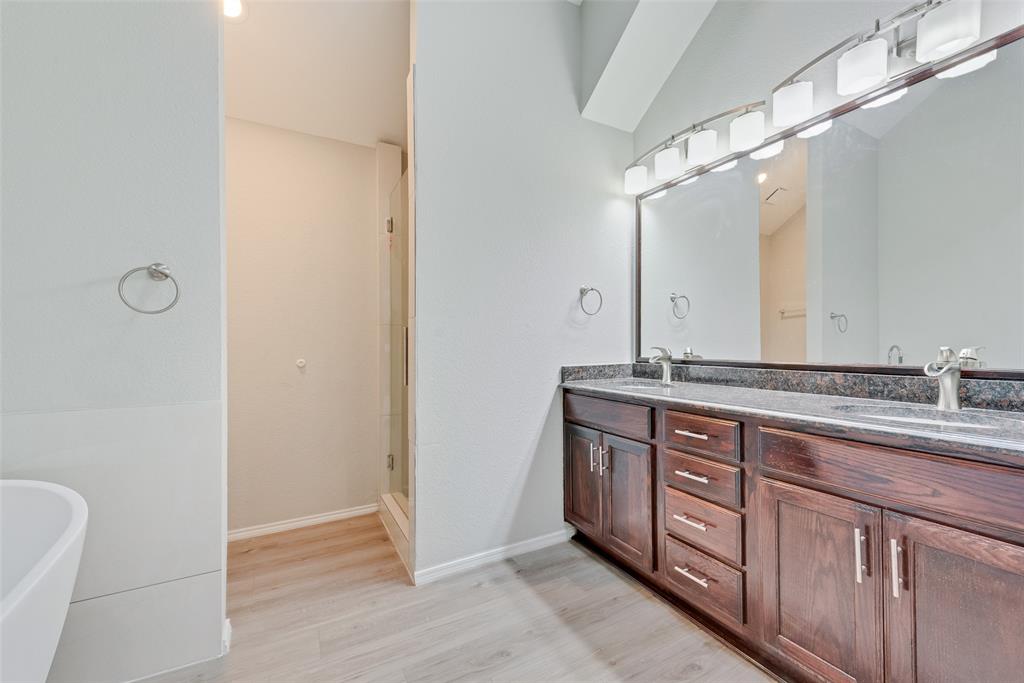 903 Ragland Drive Cedar Hill, TX 75104 - Photo 28 of 33 a bathroom with a granite countertop sink and a mirror