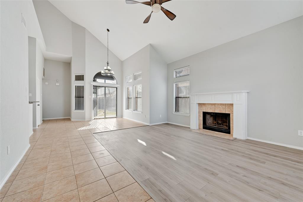 903 Ragland Drive Cedar Hill, TX 75104 - Photo 4 of 33 a view of an empty room with a fireplace and a window