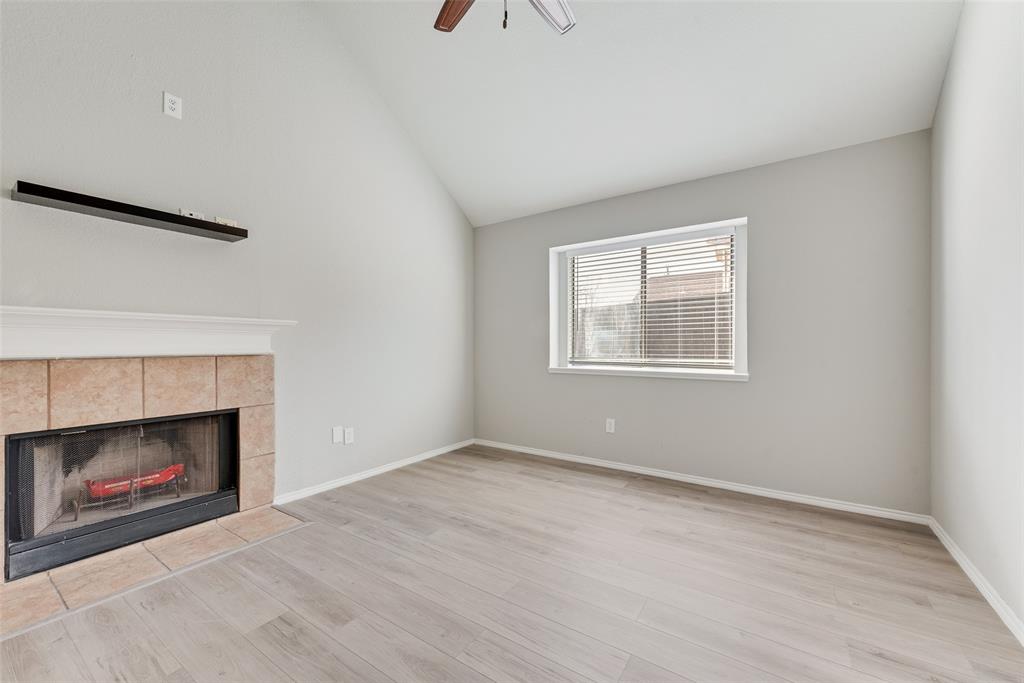 903 Ragland Drive Cedar Hill, TX 75104 - Photo 6 of 33 a view of an empty room with a fireplace and a window