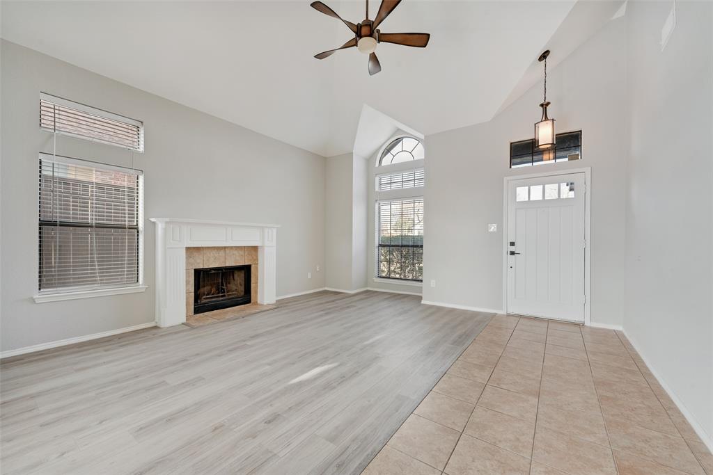 903 Ragland Drive Cedar Hill, TX 75104 - Photo 8 of 33 an empty room with windows and fireplace
