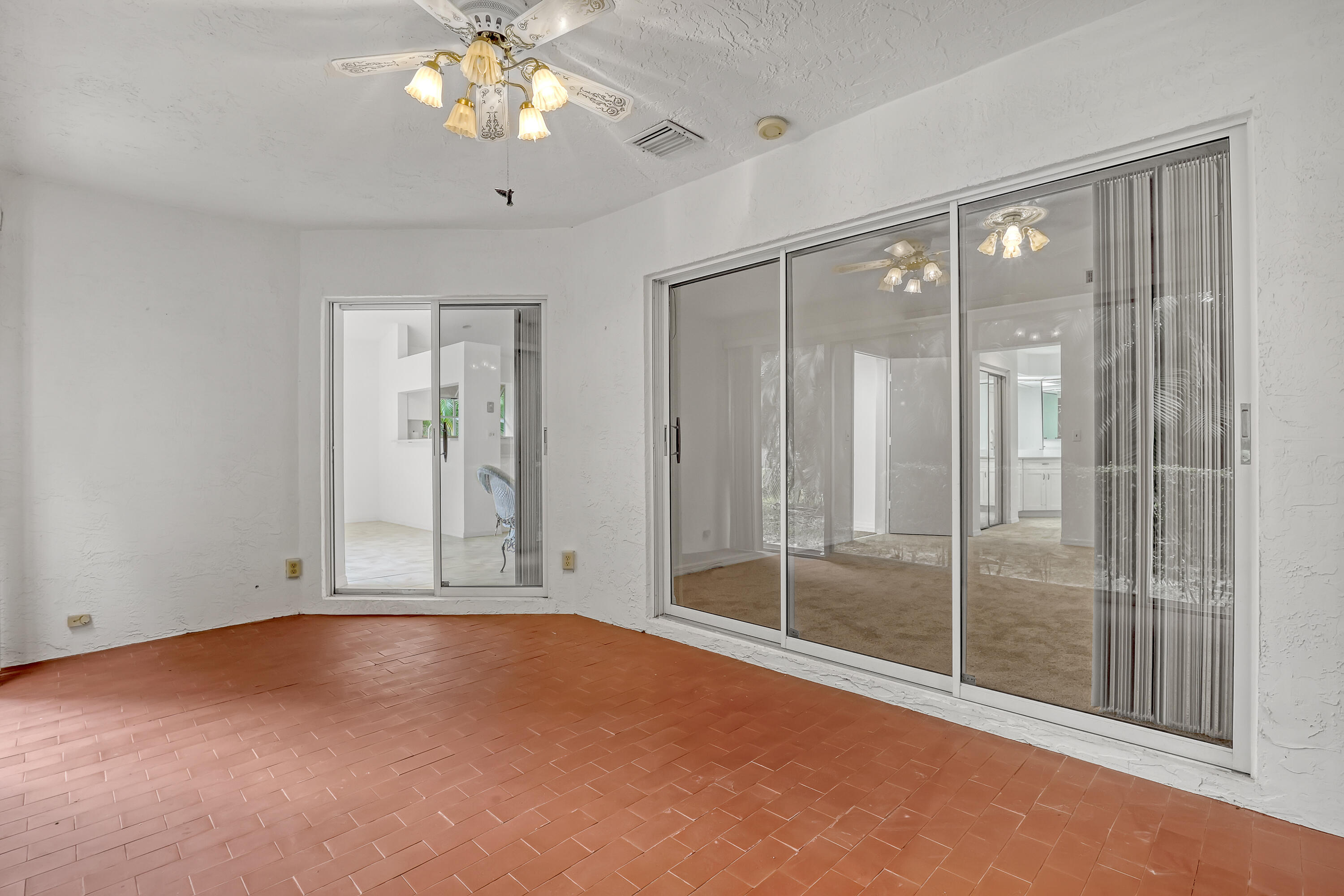11120 Rios Road Boca Raton, FL 33498 - Photo 20 of 36 a view of an empty room with a window