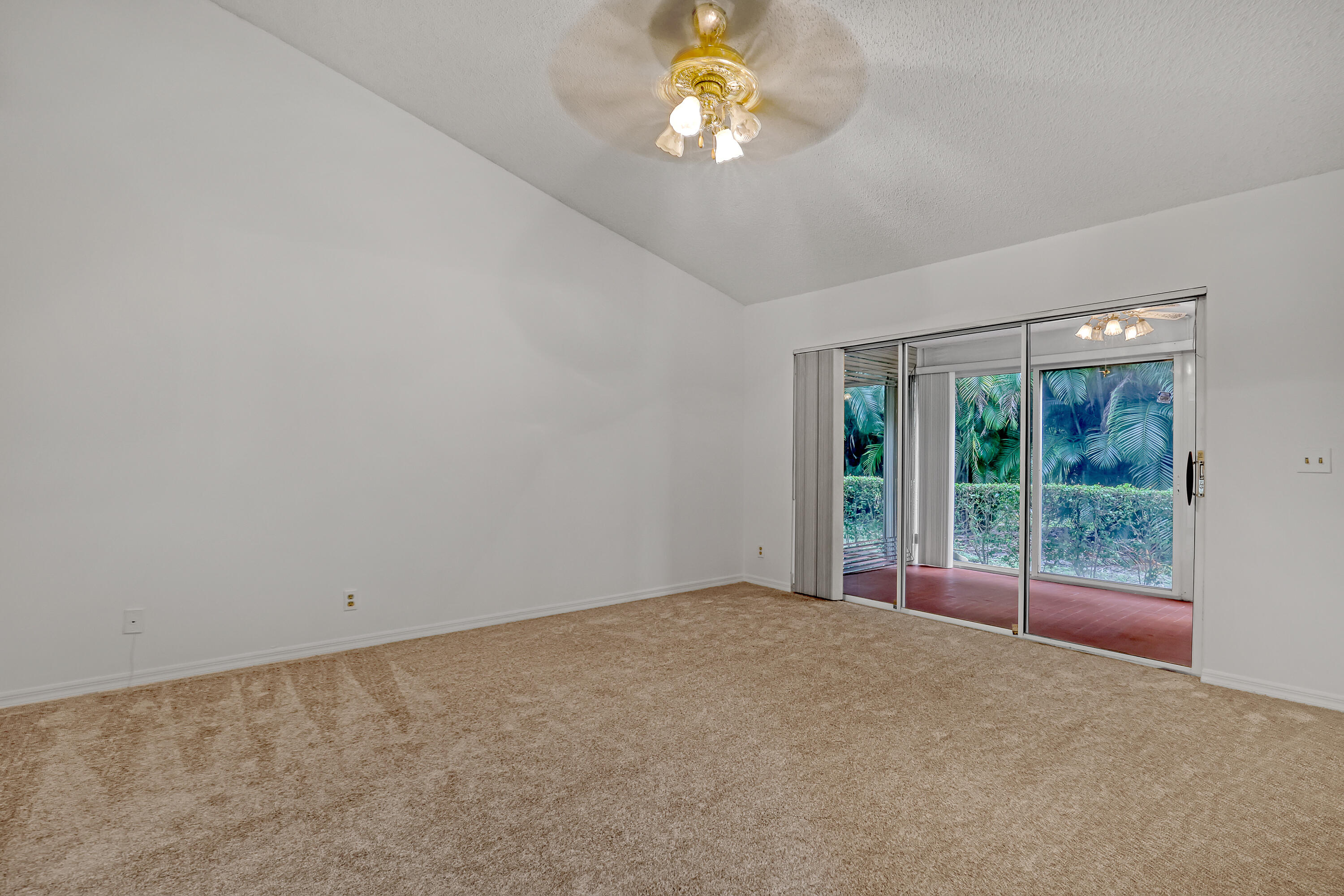 11120 Rios Road Boca Raton, FL 33498 - Photo 21 of 36 a view of an empty room with a window