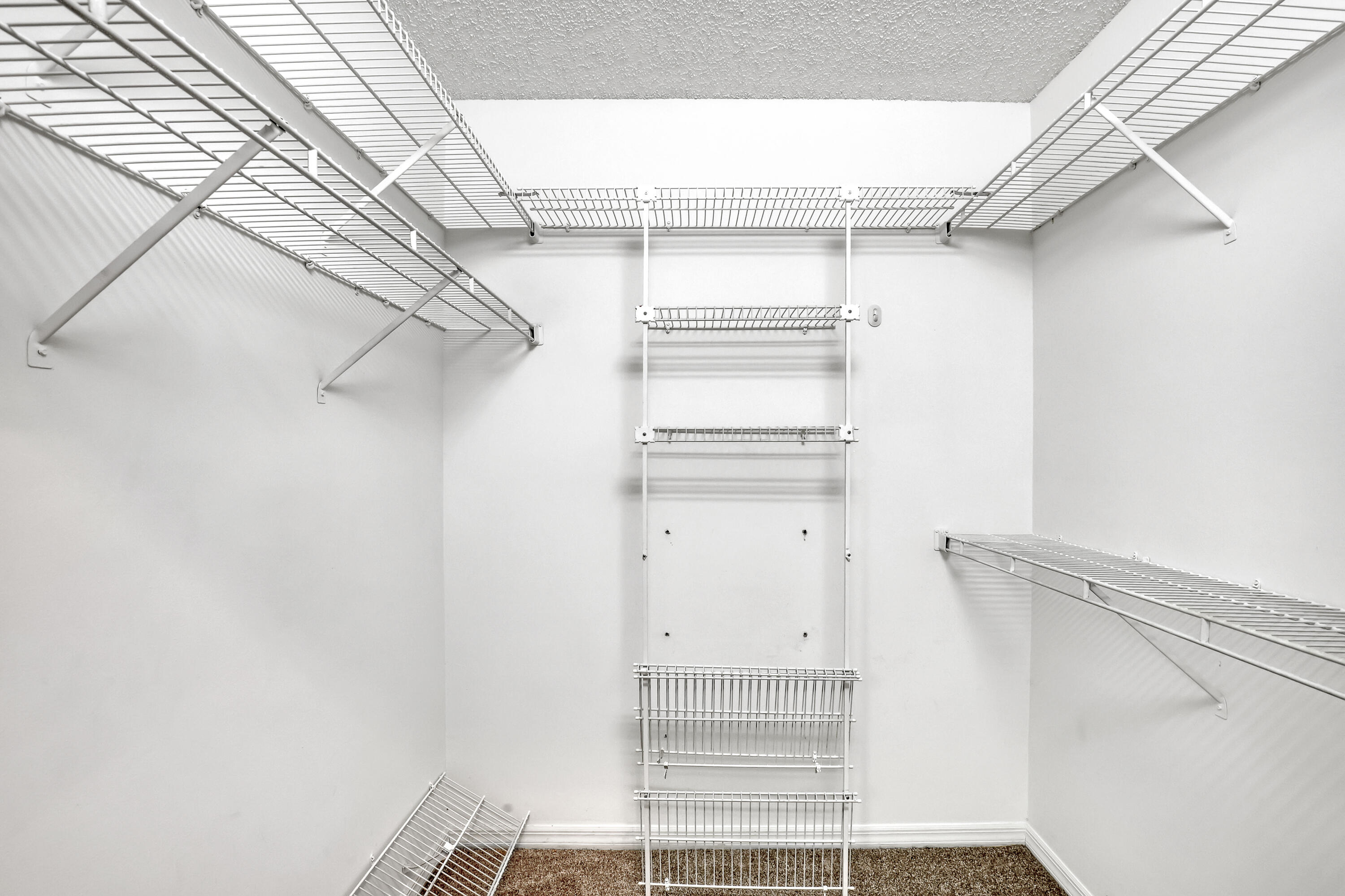 11120 Rios Road Boca Raton, FL 33498 - Photo 24 of 36 a view of a room with racks on the wall
