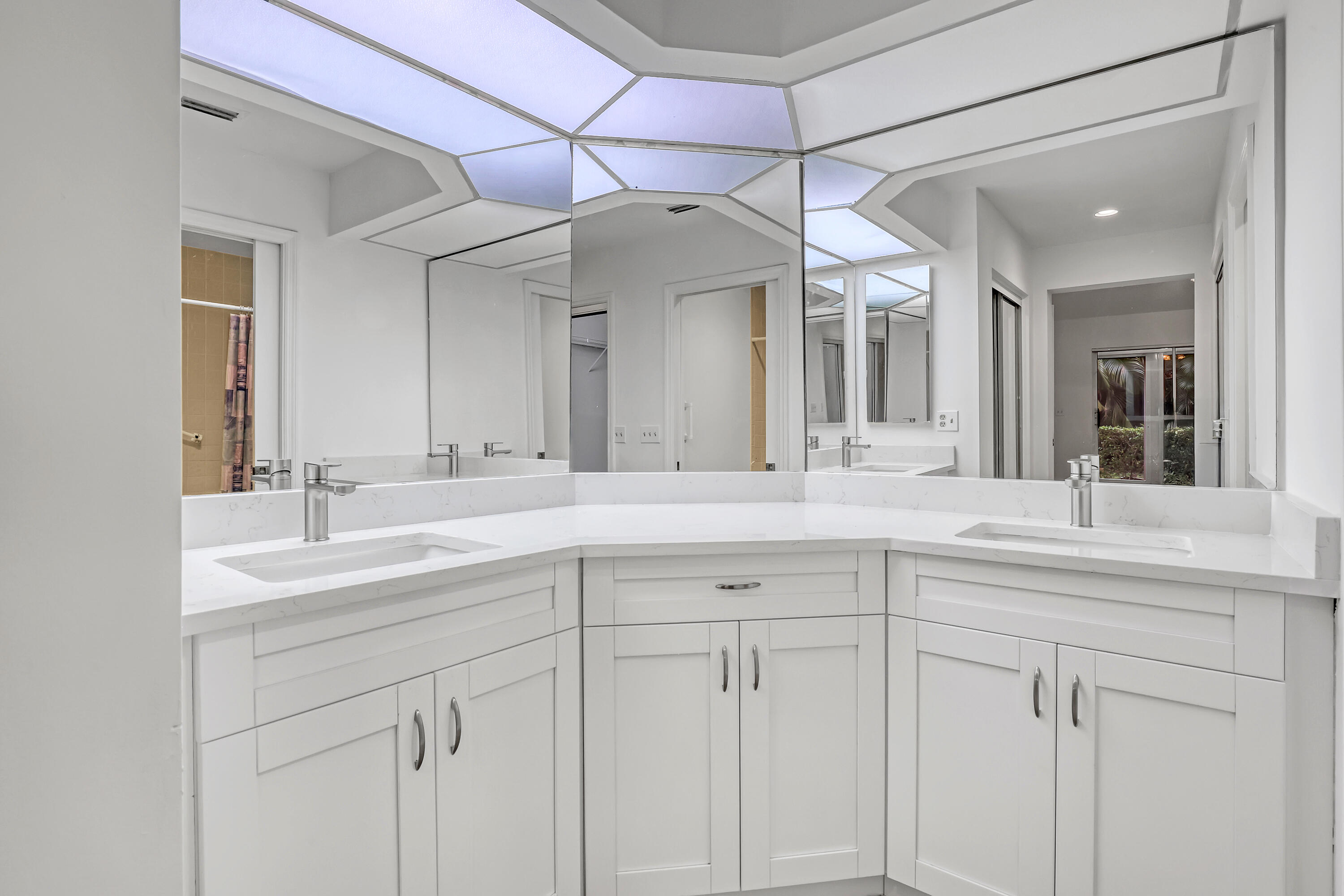 11120 Rios Road Boca Raton, FL 33498 - Photo 25 of 36 a bathroom with a sink and a mirror