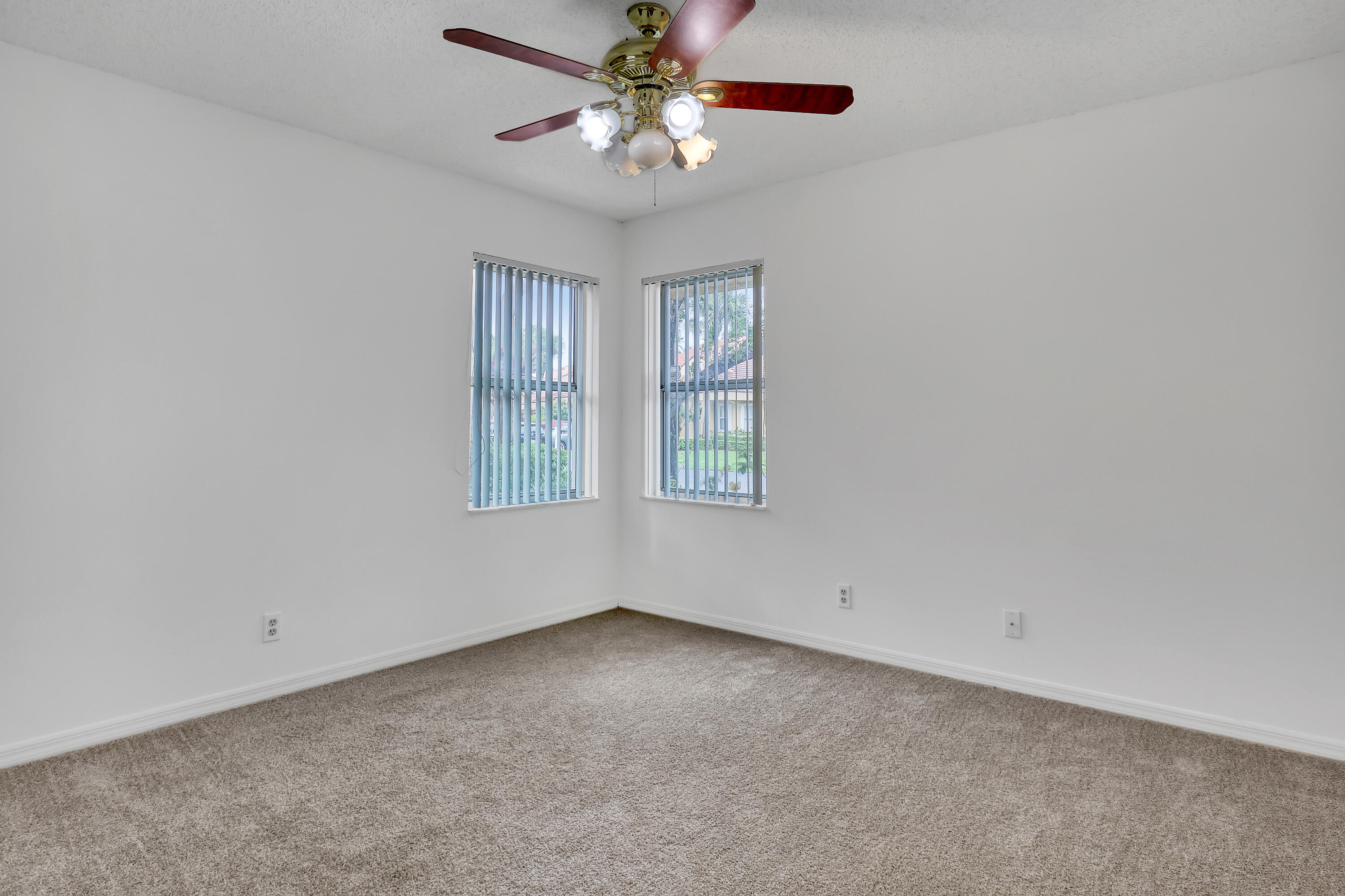 11120 Rios Road Boca Raton, FL 33498 - Photo 27 of 36 an empty room with a window and a fan
