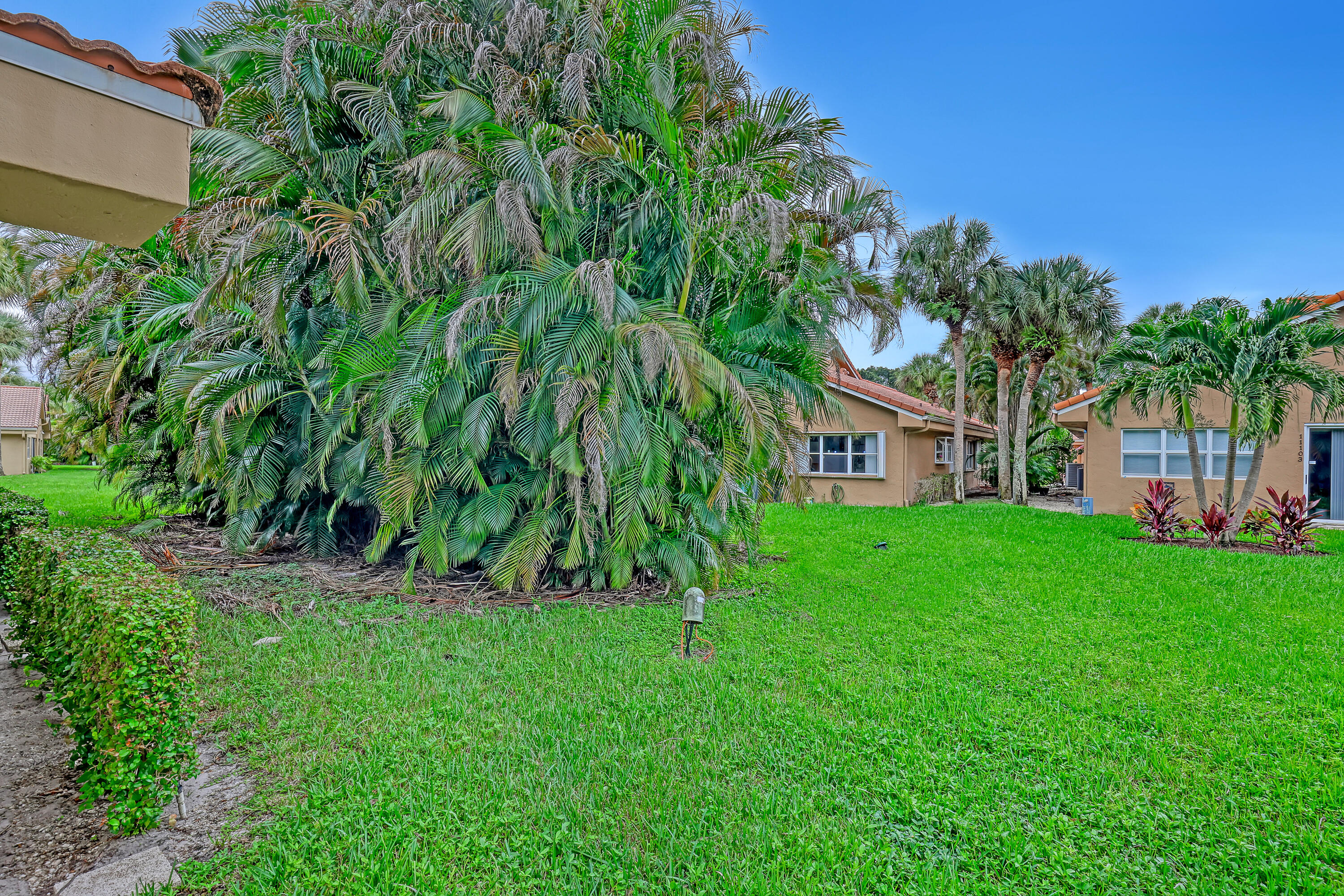 11120 Rios Road Boca Raton, FL 33498 - Photo 34 of 36 a view of house with a yard