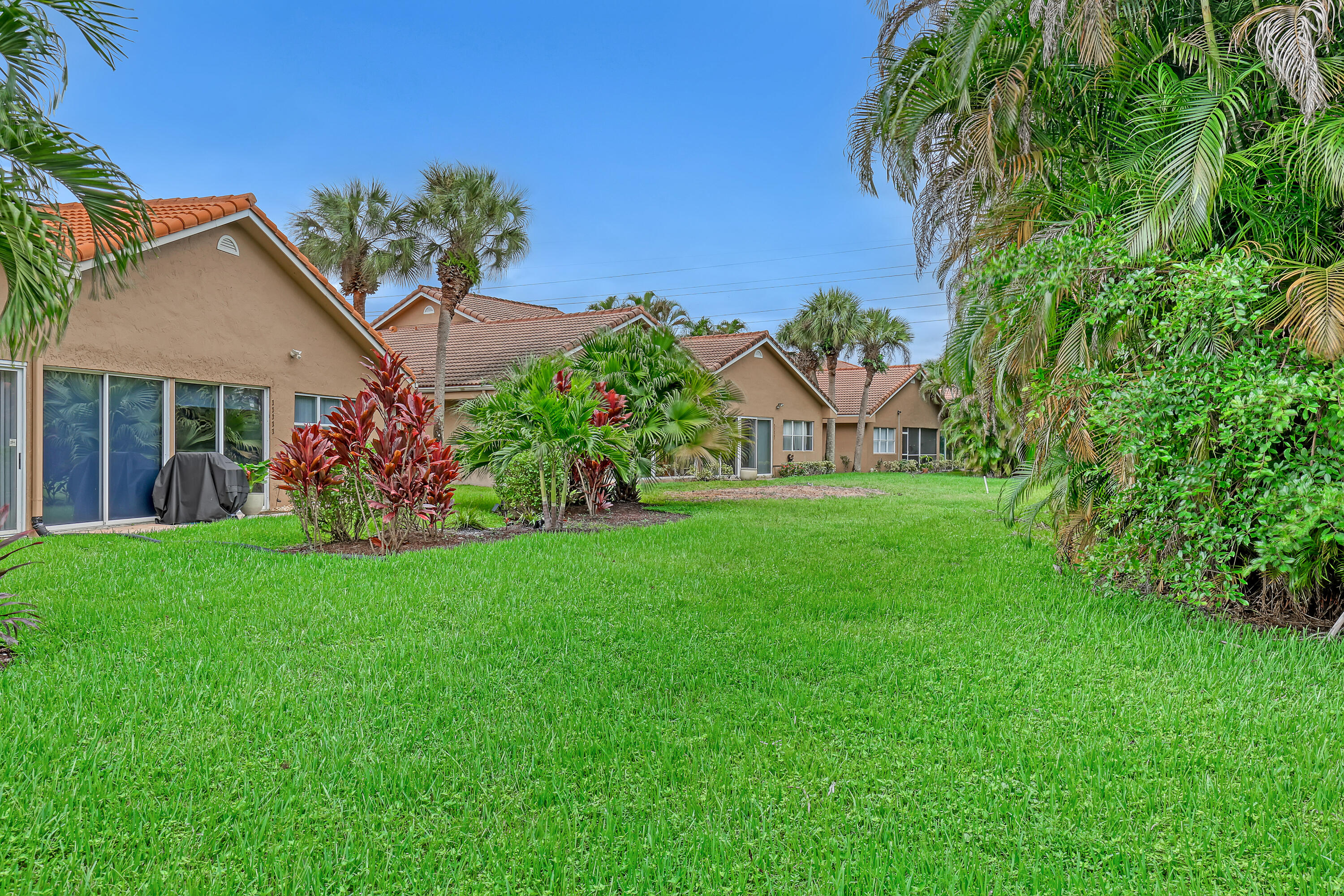 11120 Rios Road Boca Raton, FL 33498 - Photo 36 of 36 a view of a house with backyard and garden
