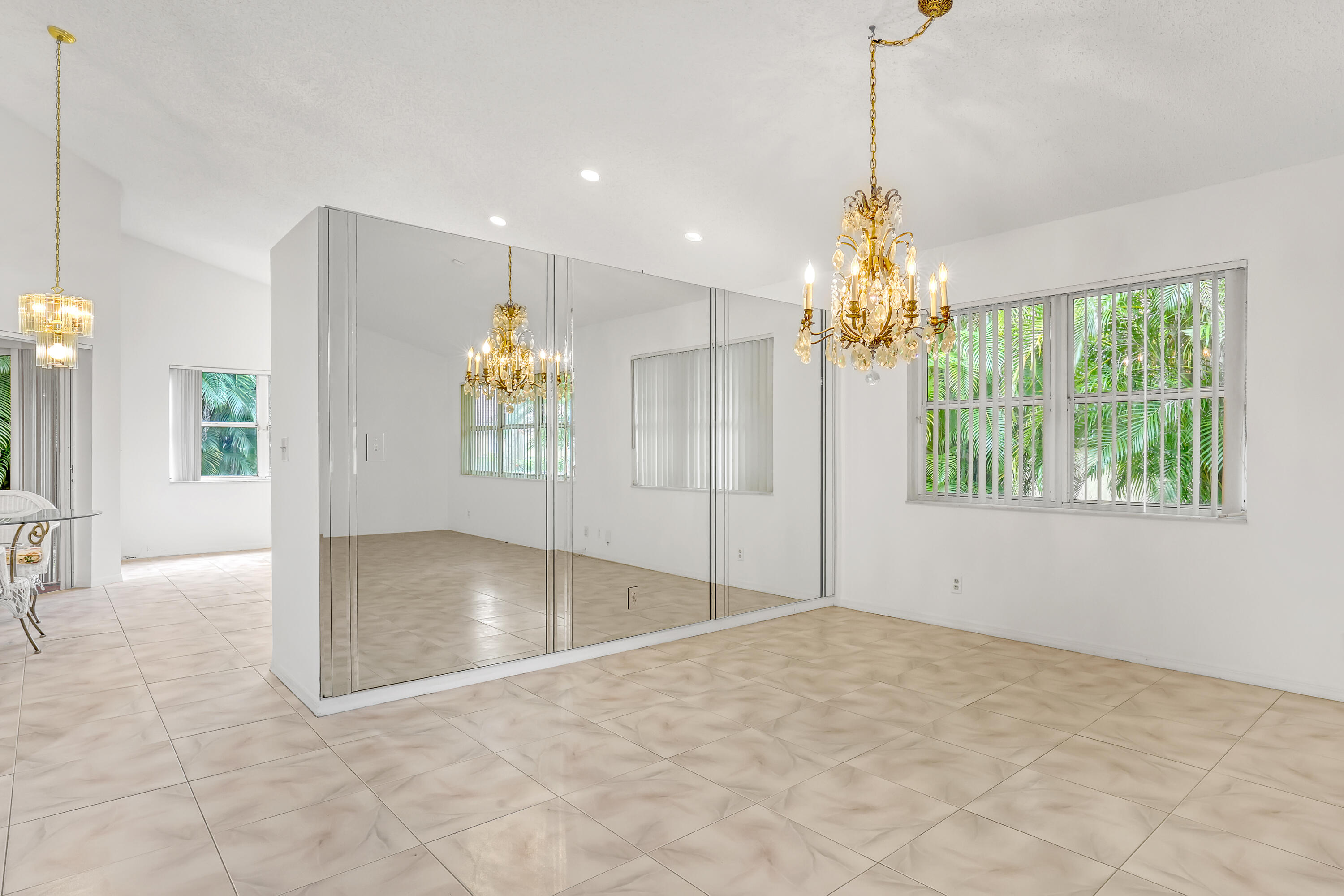 11120 Rios Road Boca Raton, FL 33498 - Photo 7 of 36 a view of a hallway with chandelier and entryway