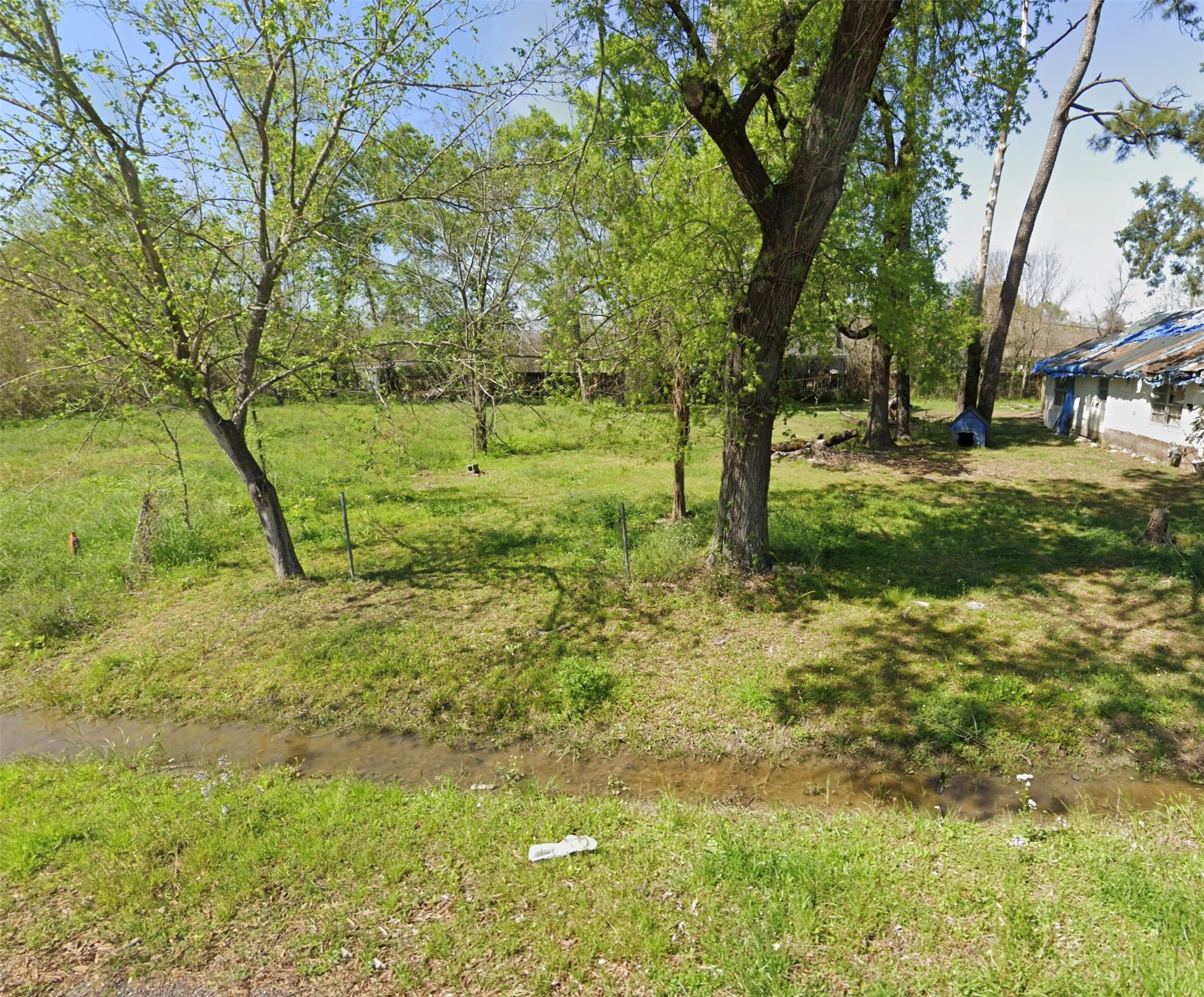 8709 Sunderland Road Houston, TX 77028 - Photo 1 of 3 a view of a yard with a tree