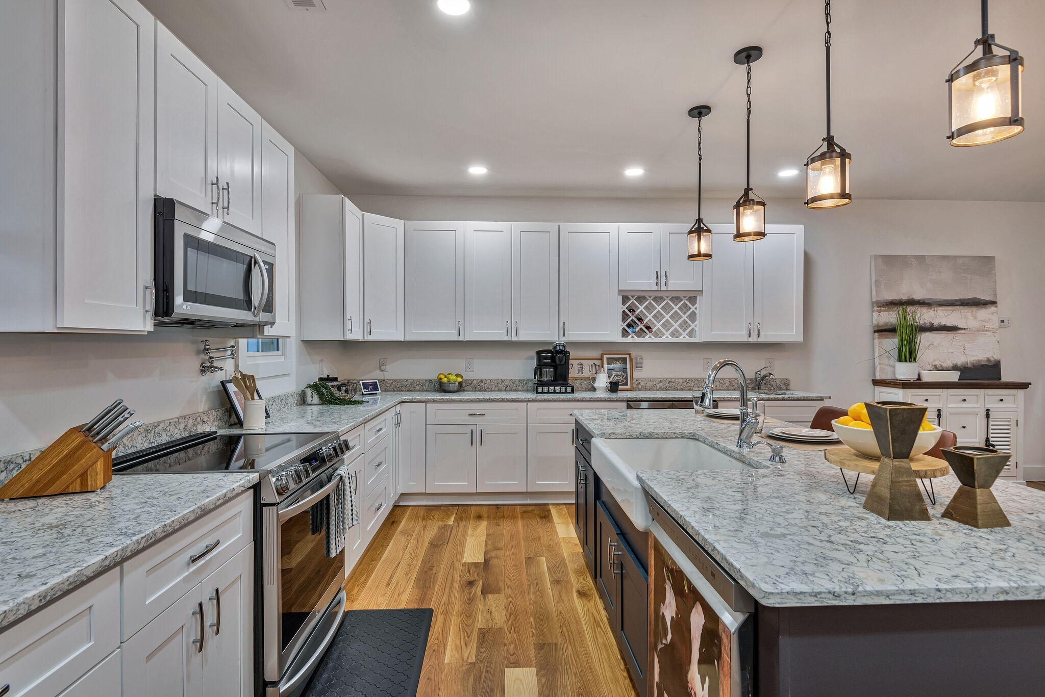 418 Lyle Lane Dickson, TN 37055 - Photo 18 of 51 a kitchen with stainless steel appliances granite countertop a sink a stove and cabinets