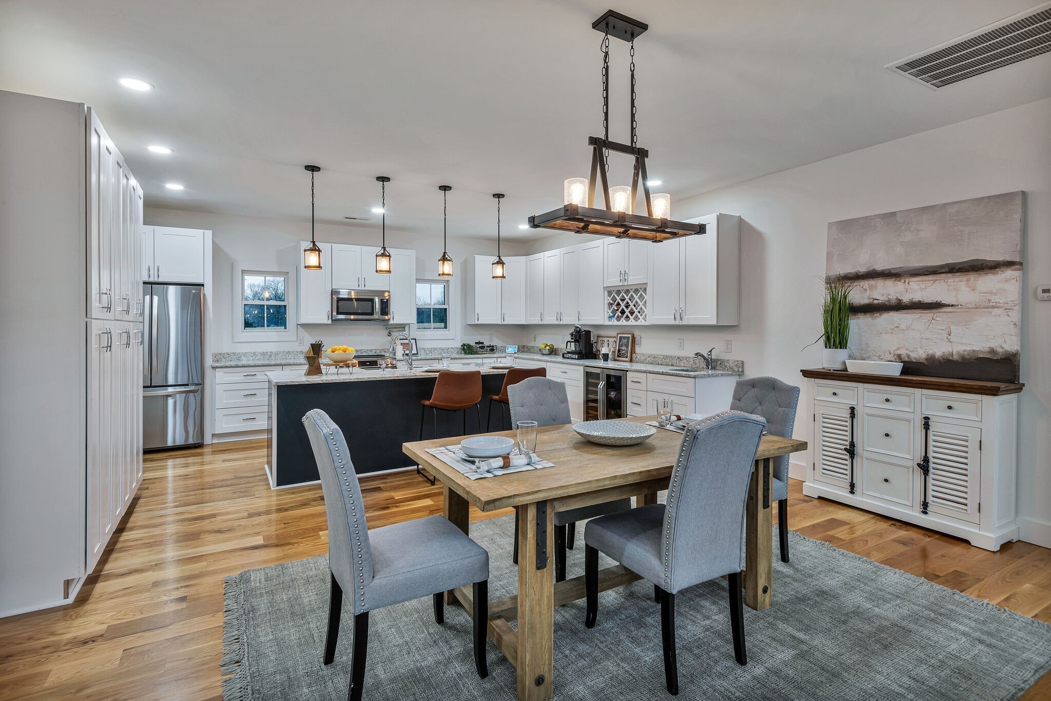 418 Lyle Lane Dickson, TN 37055 - Photo 20 of 51 a dining room with stainless steel appliances kitchen island a table chairs and a kitchen view
